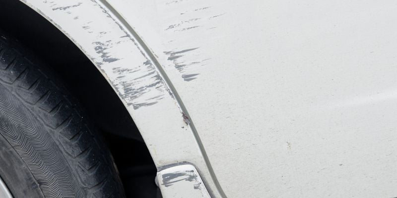 Several marks on a car panel before the gallery pen repair